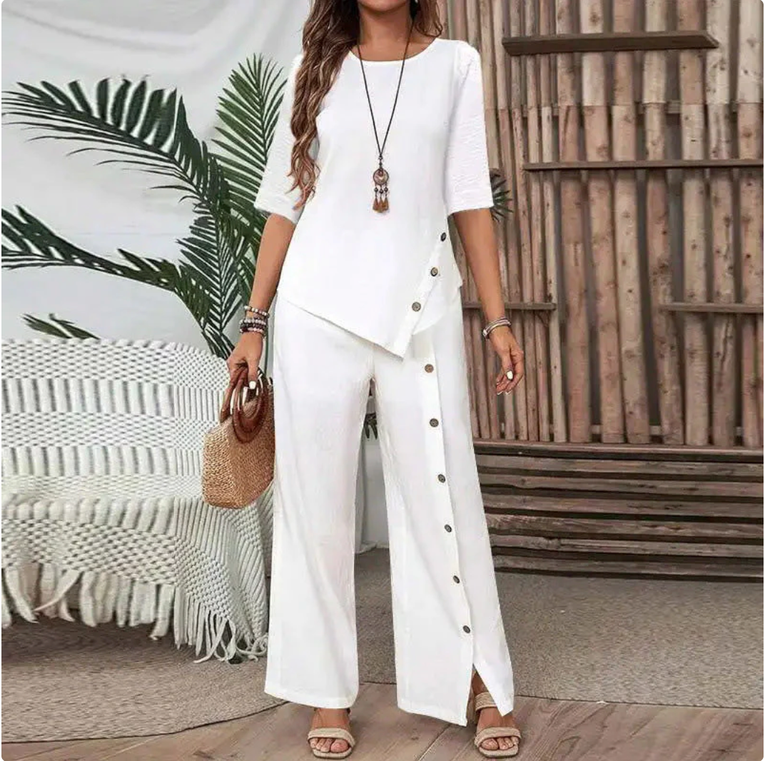 Completo due pezzi da donna: top con orlo asimmetrico e pantaloni a gamba larga, look moderno e confortevole 💃