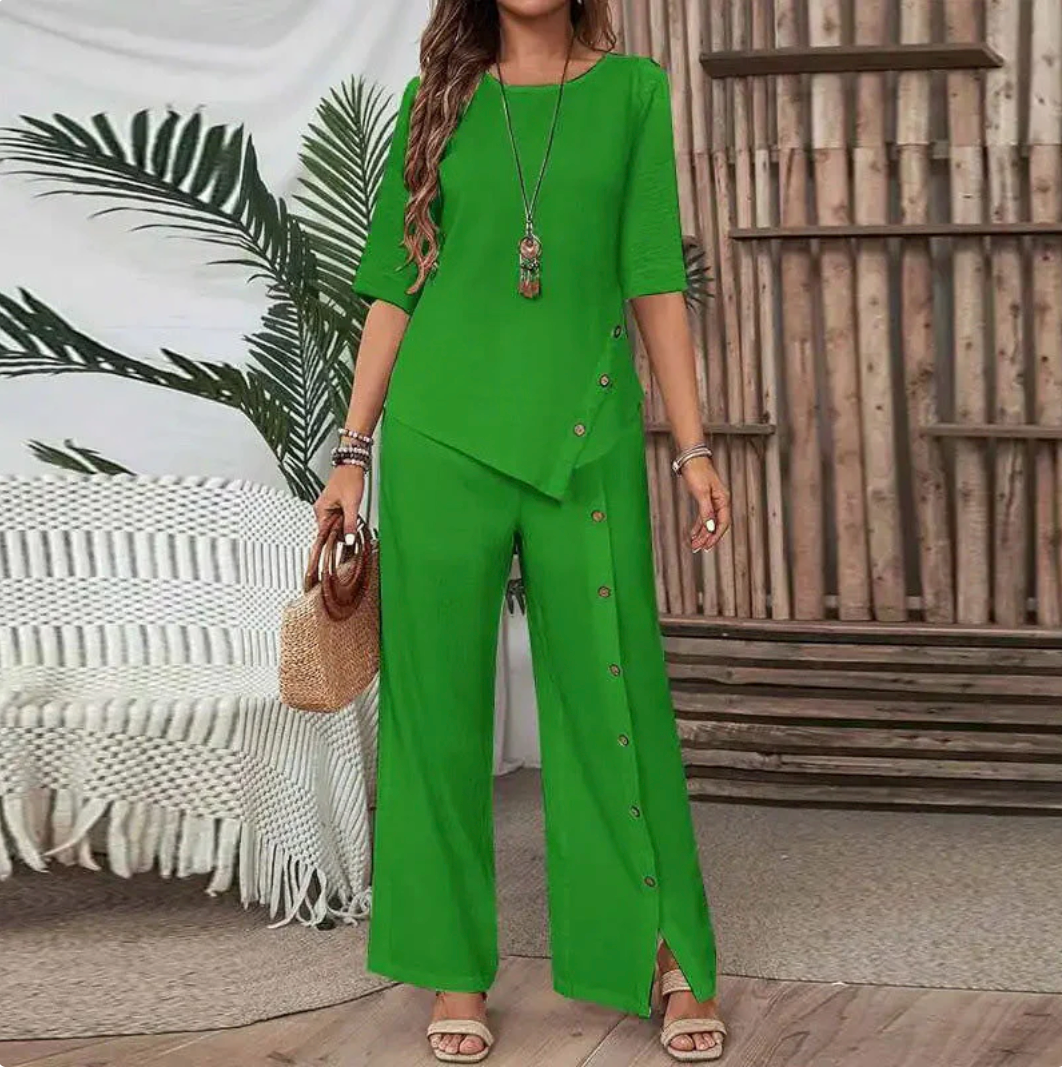 Completo due pezzi da donna: top con orlo asimmetrico e pantaloni a gamba larga, look moderno e confortevole 💃