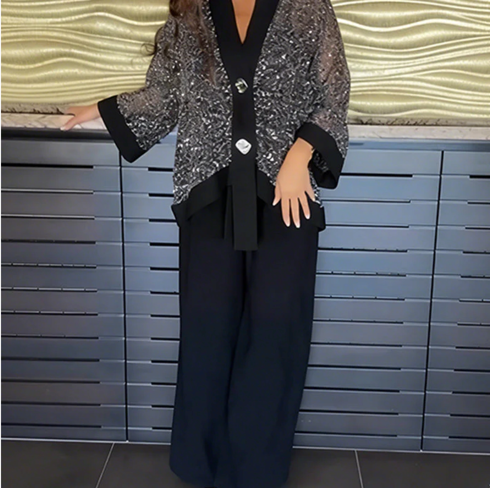 Completo da donna composto da cardigan con scollo a V e paillettes e pantaloni a gamba larga.