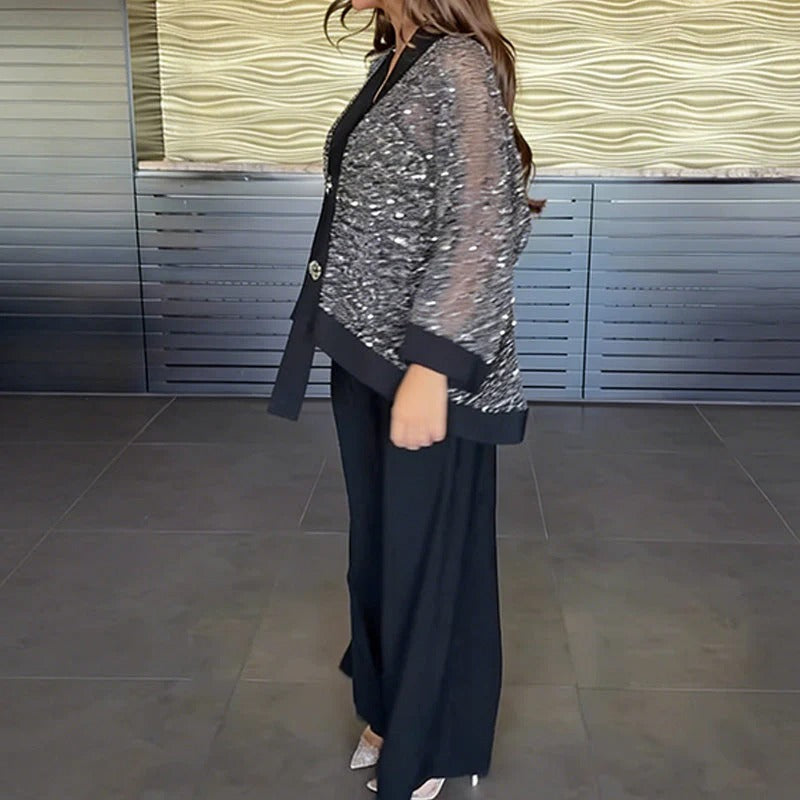Completo da donna composto da cardigan con scollo a V e paillettes e pantaloni a gamba larga.