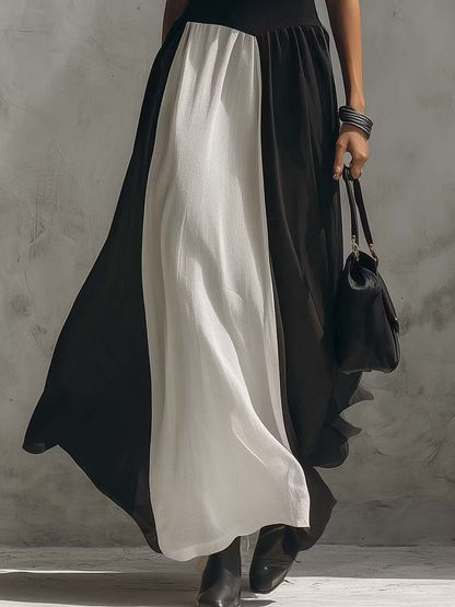 Abito lungo senza maniche in tulle di finto cotone e lino con blocchi di colore bianco e nero.