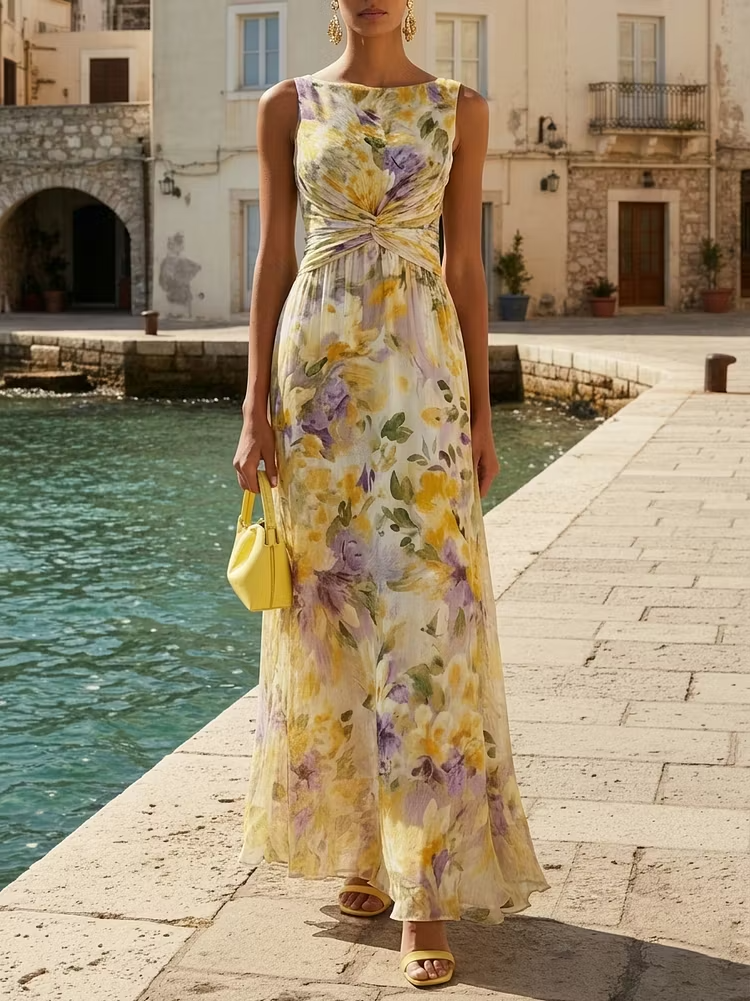 Abito lungo a trapezio senza maniche in chiffon giallo con scollo a barca e stampa floreale