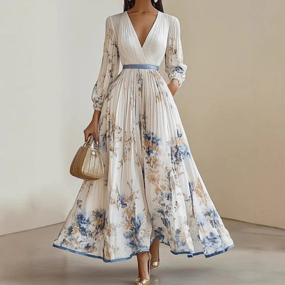Elegante abito lungo plissettato con scollo a V e stampa floreale.