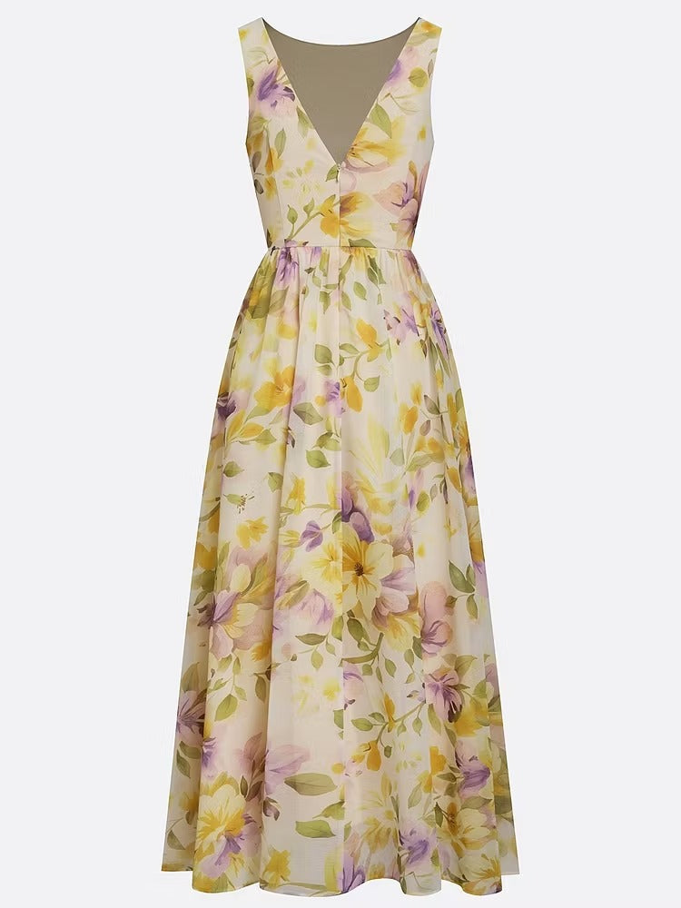 Abito lungo a trapezio senza maniche in chiffon giallo con scollo a barca e stampa floreale