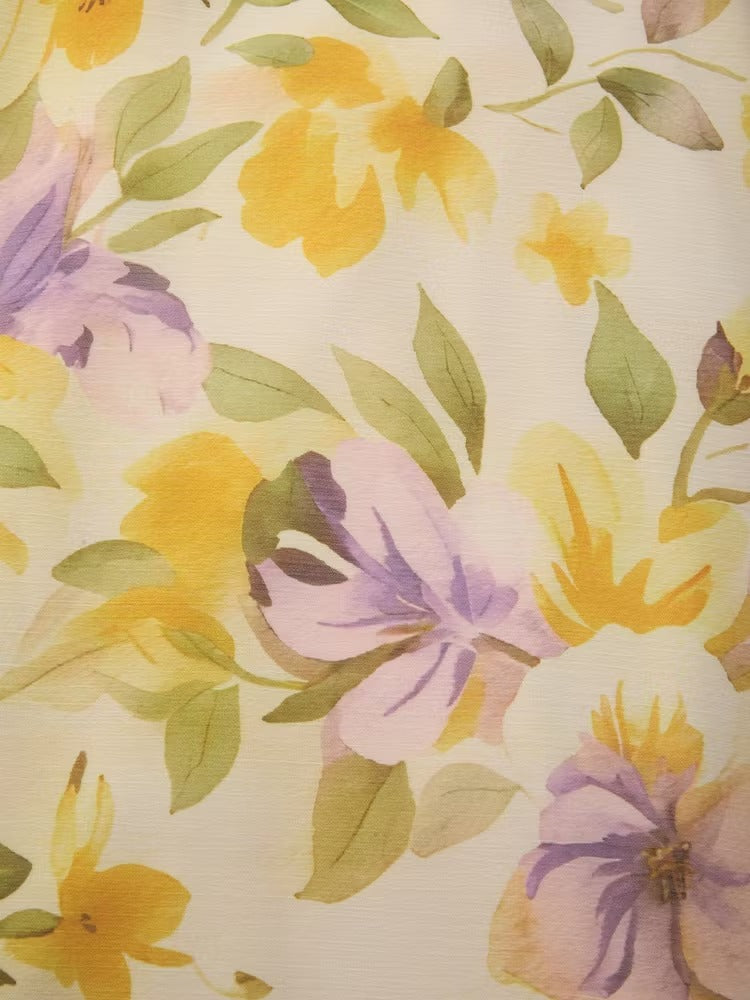 Abito lungo a trapezio senza maniche in chiffon giallo con scollo a barca e stampa floreale