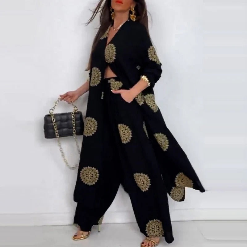 Completo da donna composto da top ampio con scollo a V e pantaloni a gamba larga stampati🌺