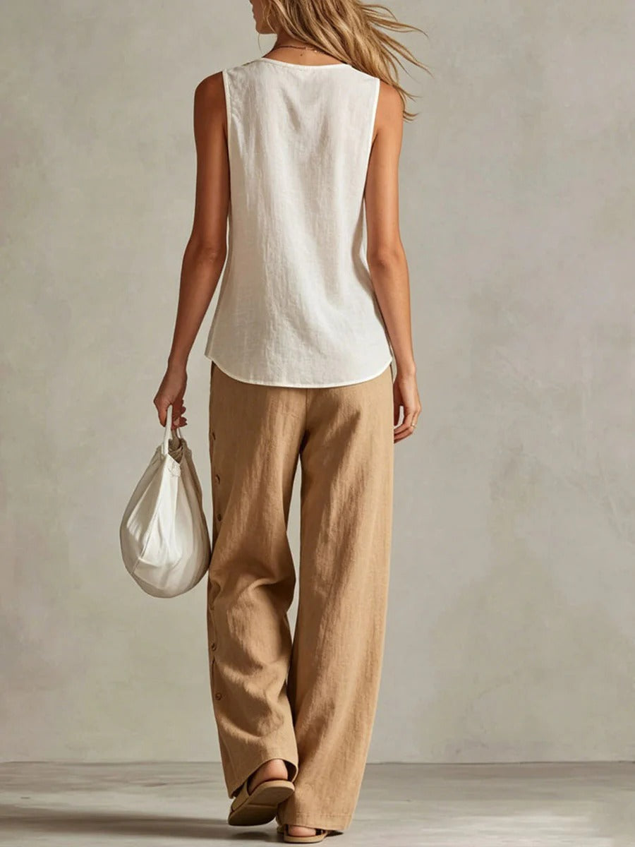 Completo casual da donna in cotone e lino: top senza maniche con scollo a V e vestibilità ampia e pantaloni a gamba larga a vita alta.