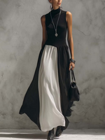 Abito lungo senza maniche in tulle di finto cotone e lino con blocchi di colore bianco e nero.