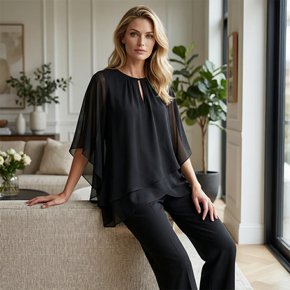 Elegante completo a due pezzi: camicetta con orlo asimmetrico e pantaloni larghi