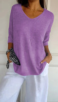 Top elegante in maglia a tinta unita con scollo a V
