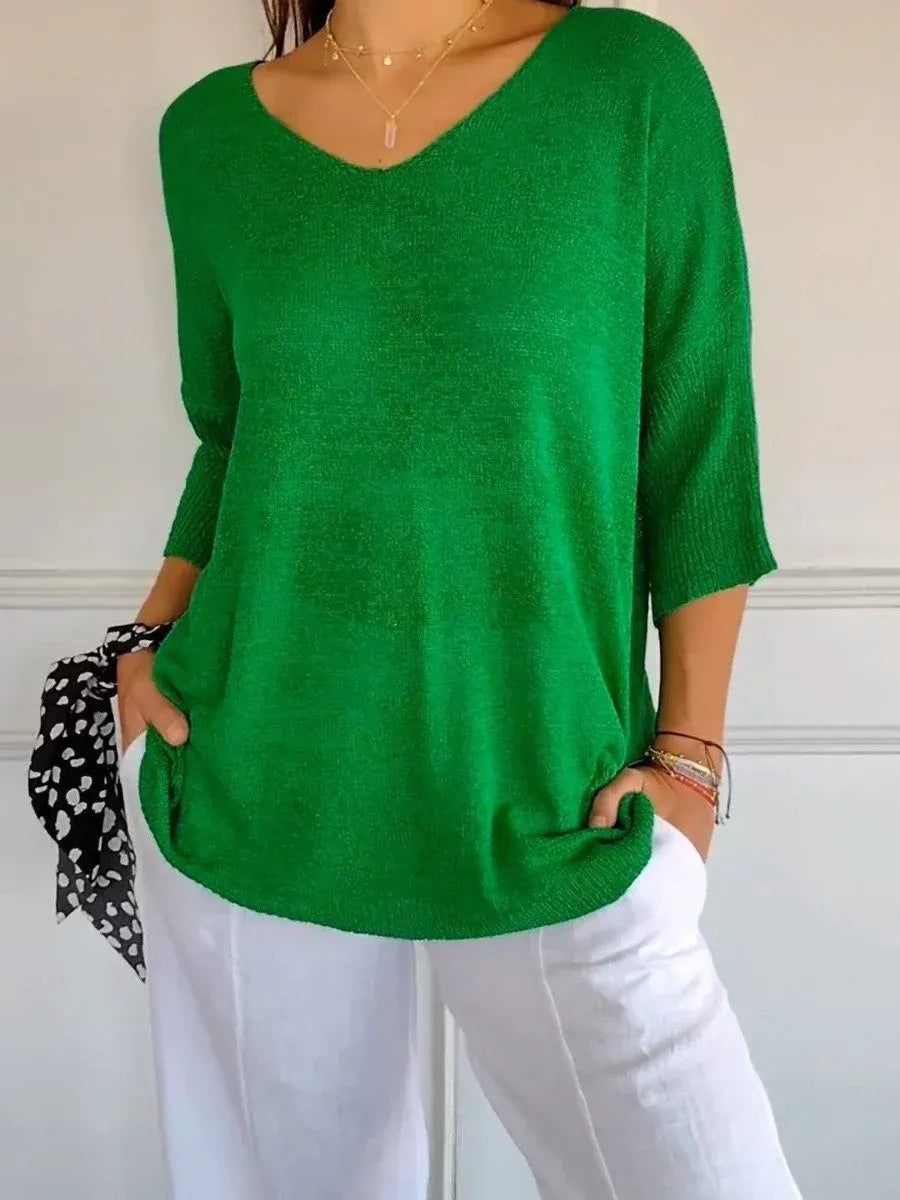 Top elegante in maglia a tinta unita con scollo a V