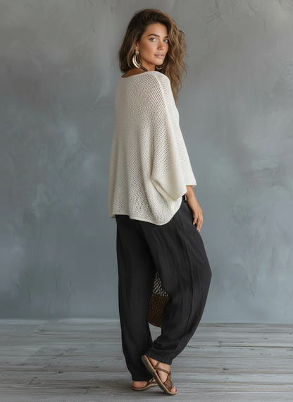 Set minimalista e leggero composto da maglione leggero con maniche a mantella e pantaloni harem